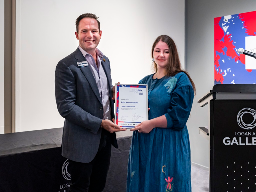 Logan City Mayor Jon Raven presenting an award to our Artist Ayla Fowles in the Logan Art Gallery.