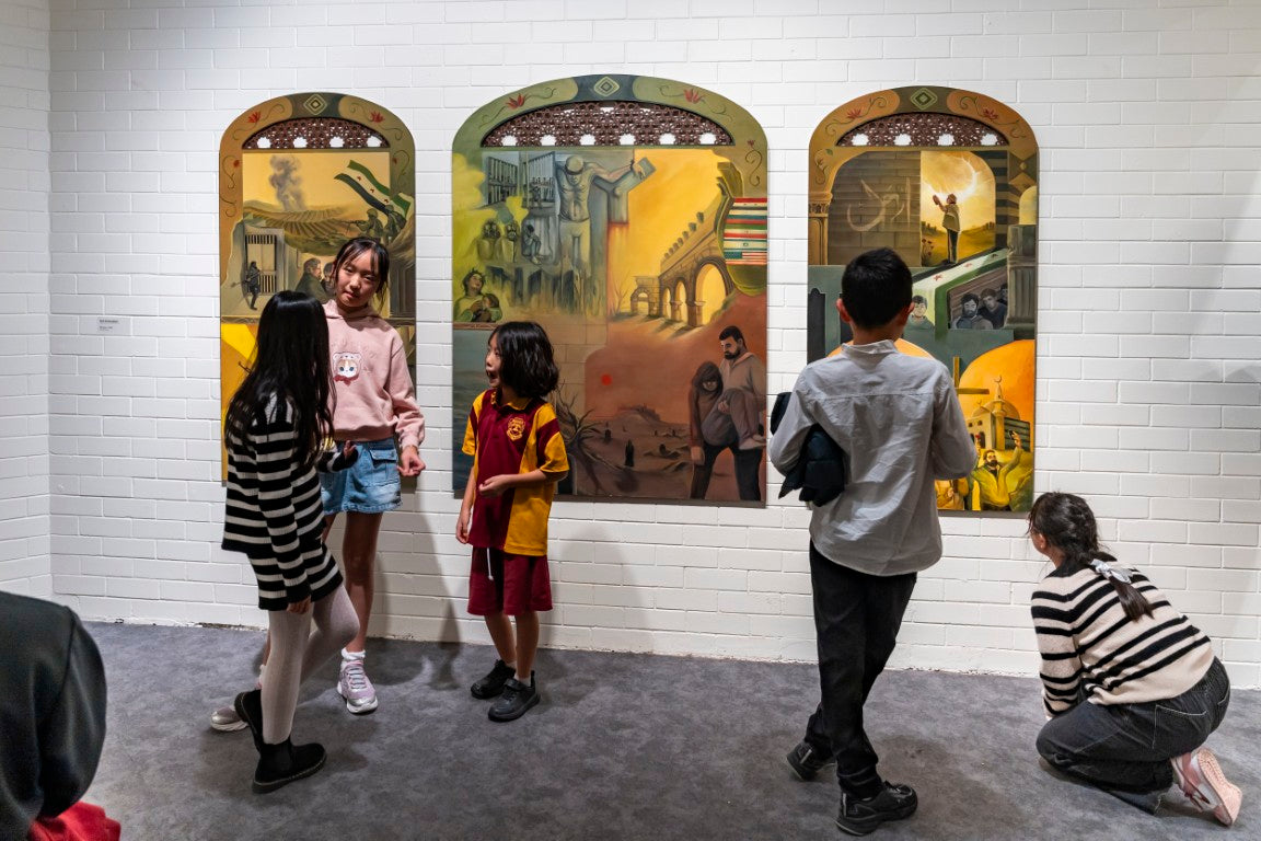 Children playing in front or and admiring the Acrylic Typtych artwork "Windows", during Queensland's Logan art gallery's Robyn Daw award.