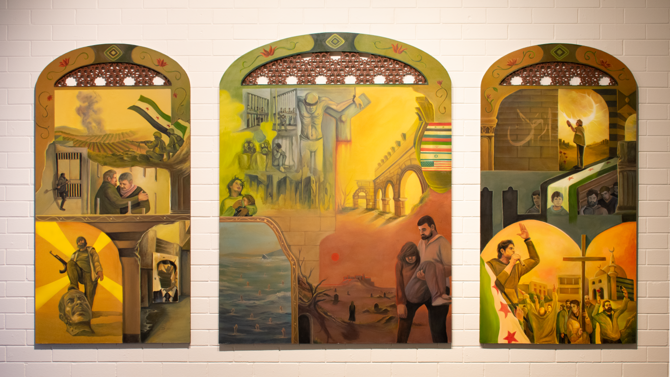 A photo of our award winning 3 piece typtych revolutionary artwork "Windows" on display at the logan art gallery.